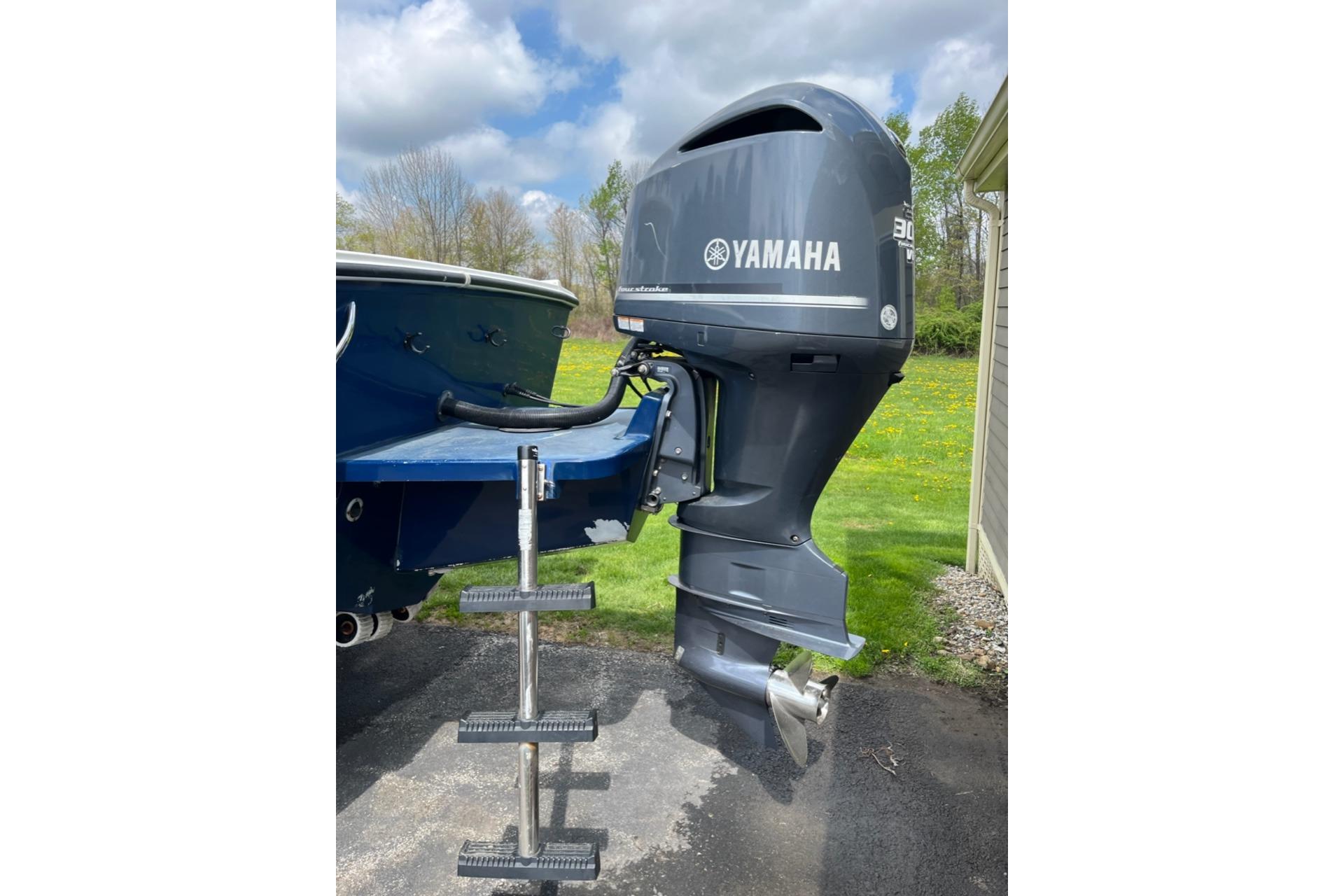 2012 Steiger Craft Miami boat with Yamaha outboard motor, parked outdoors.
