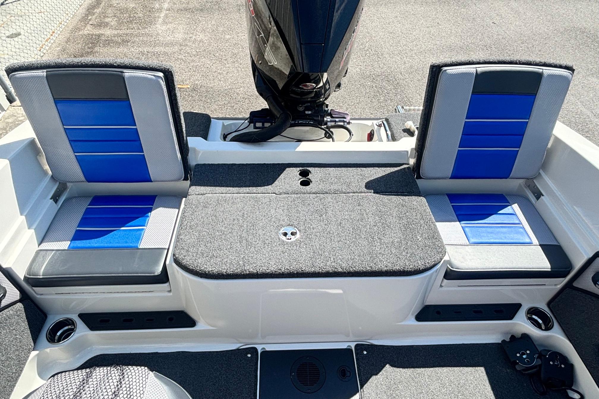 2022 Ranger 1880MS boat interior with blue and gray seating, rear motor view.