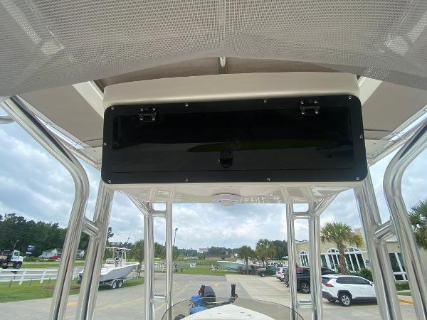 2024 Key West 203 FS boat console with overhead storage compartment.