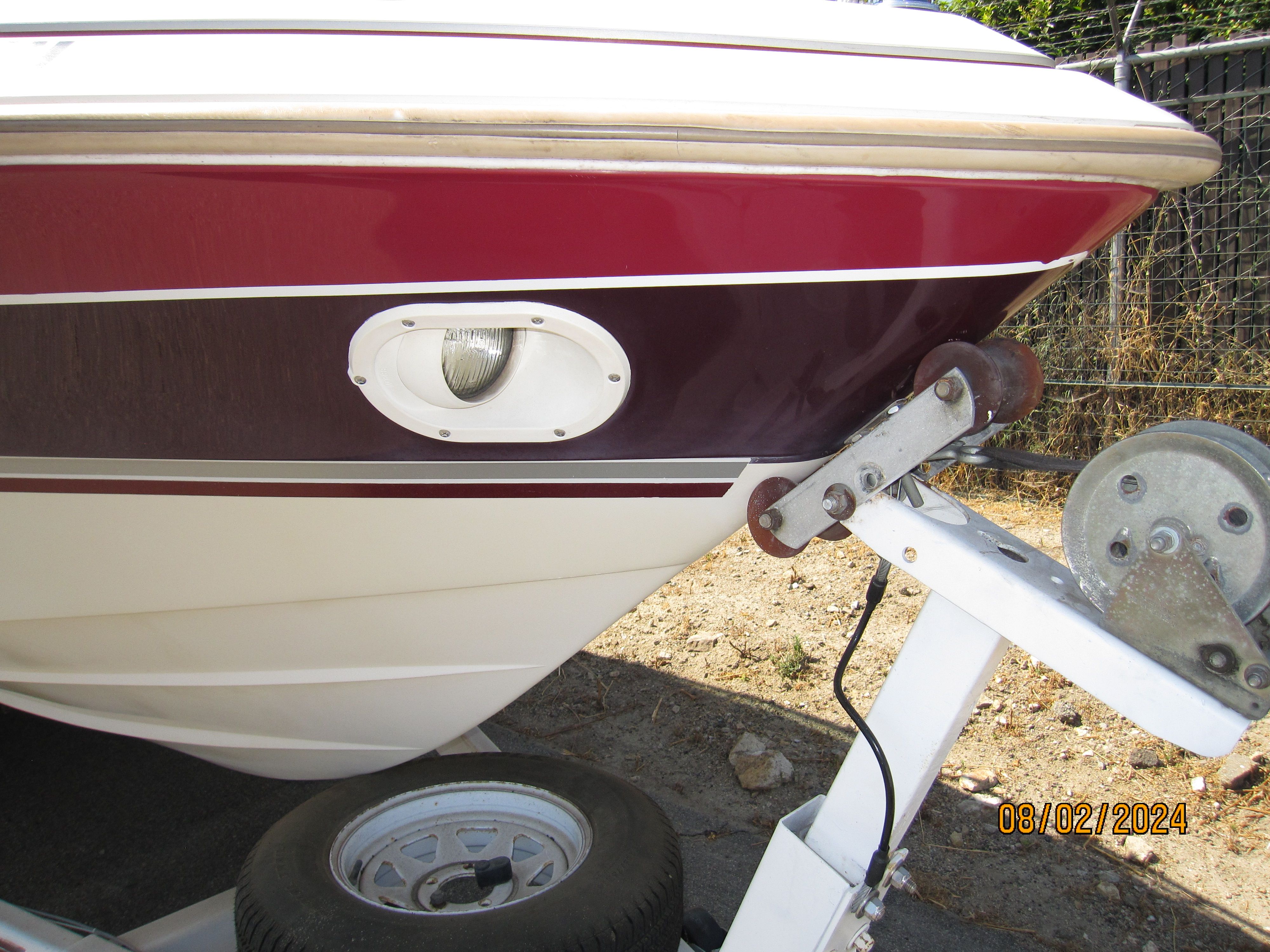 1990 Cobalt Bowrider Classic boat on trailer, close-up view.