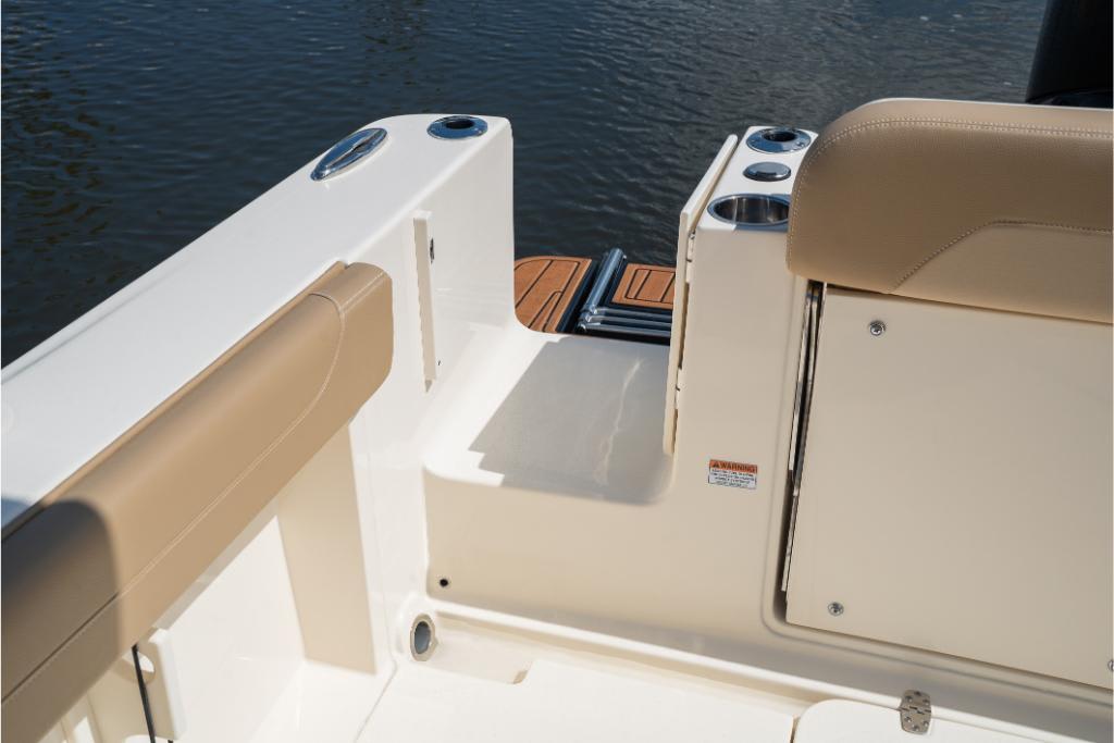 2023 Scout 240 Dorado boat interior with beige seating and cup holders.