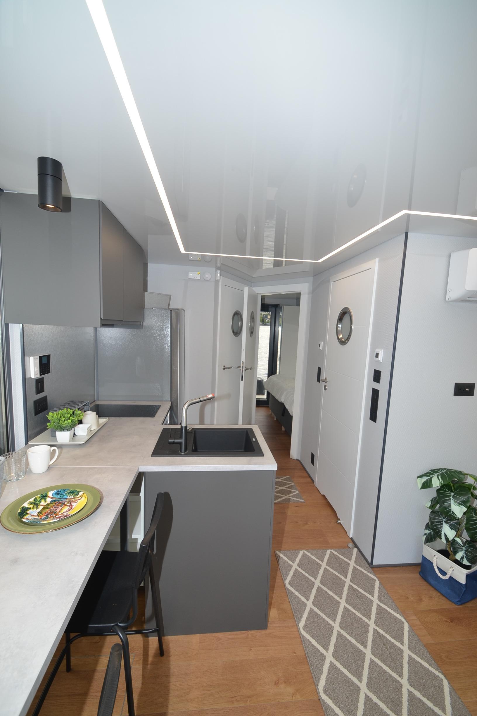 Modern kitchen interior in La Mare Modern 11, 2024 model, featuring sleek design and contemporary decor.