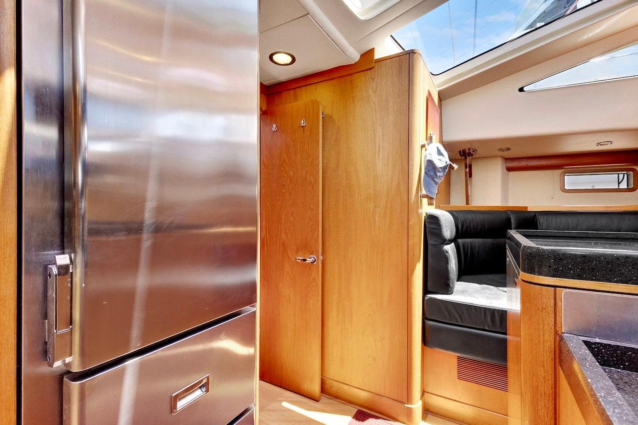 Interior of 2011 Southerly 57 RS yacht with modern kitchen and seating area.
