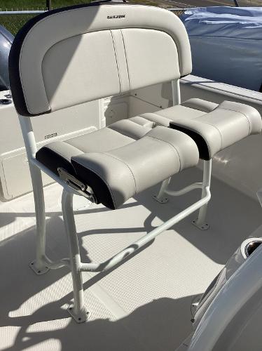 2022 Sailfish 220 CC boat seat with white cushioned design.