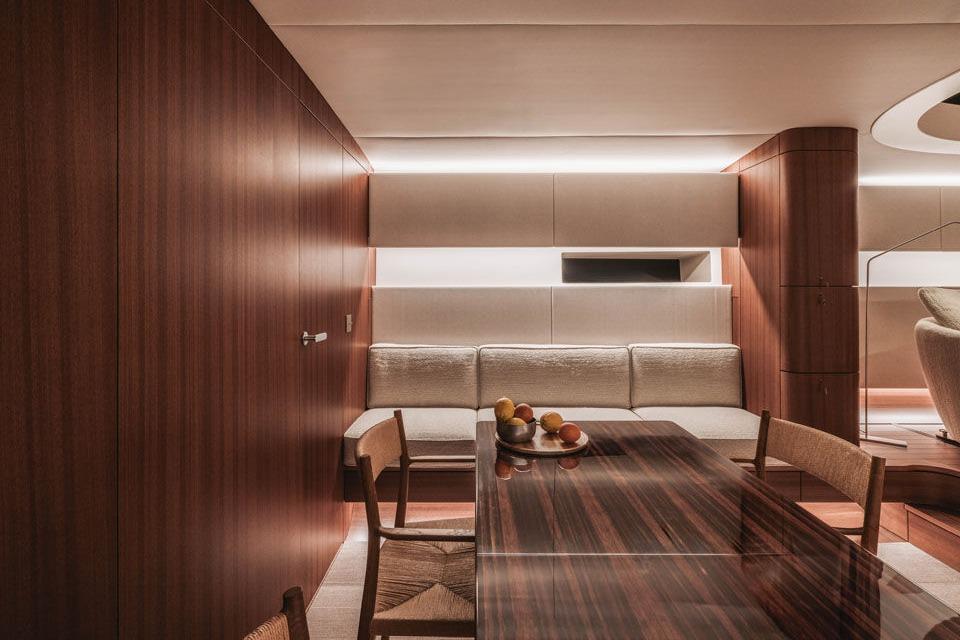 Luxurious interior of 2024 YYachts Y8, featuring elegant wood paneling and modern furnishings.