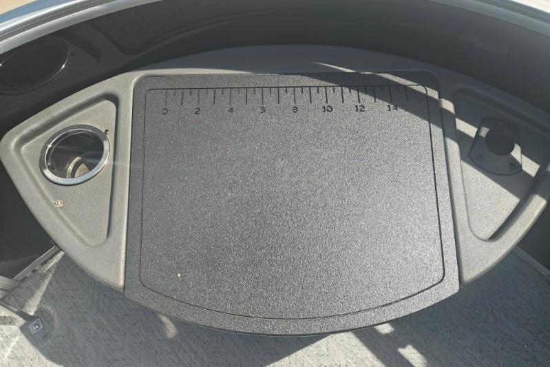Dashboard of 2026 Sun Tracker Fishin' Barge 20 DLX with integrated ruler.