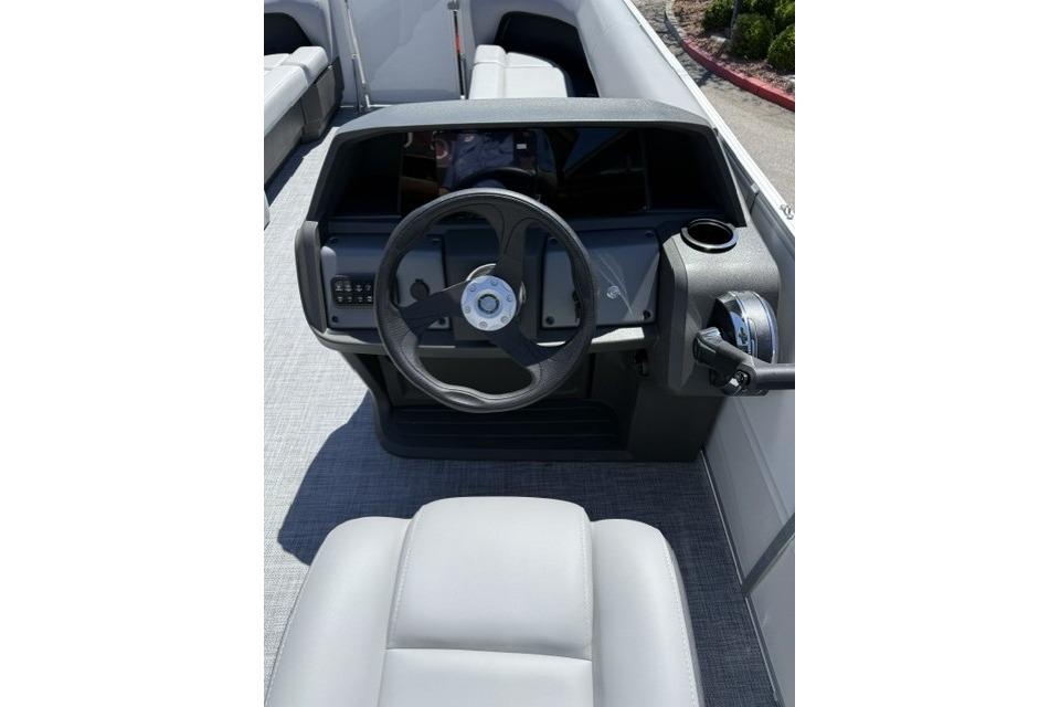 Steering console of 2026 Sun Tracker Party Barge 18 DLX pontoon boat.
