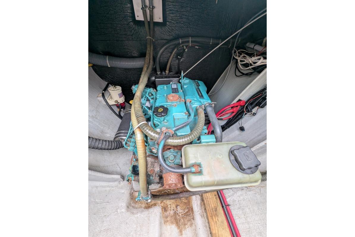 Engine compartment of a 2016 Nautitech 40 Open catamaran, featuring visible hoses and wiring.