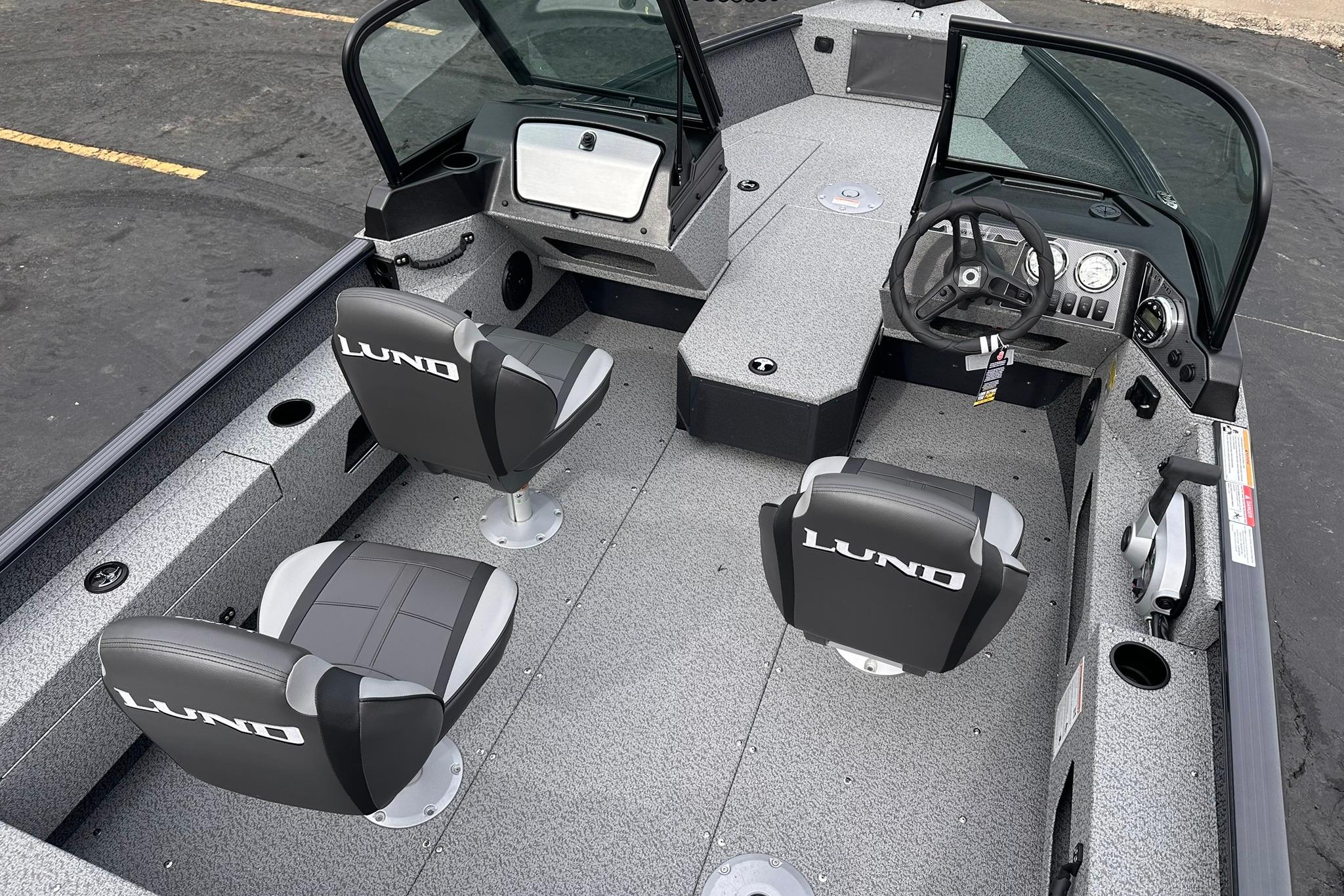 2026 Lund 1775 Adventure Sport boat interior with seating and steering console.