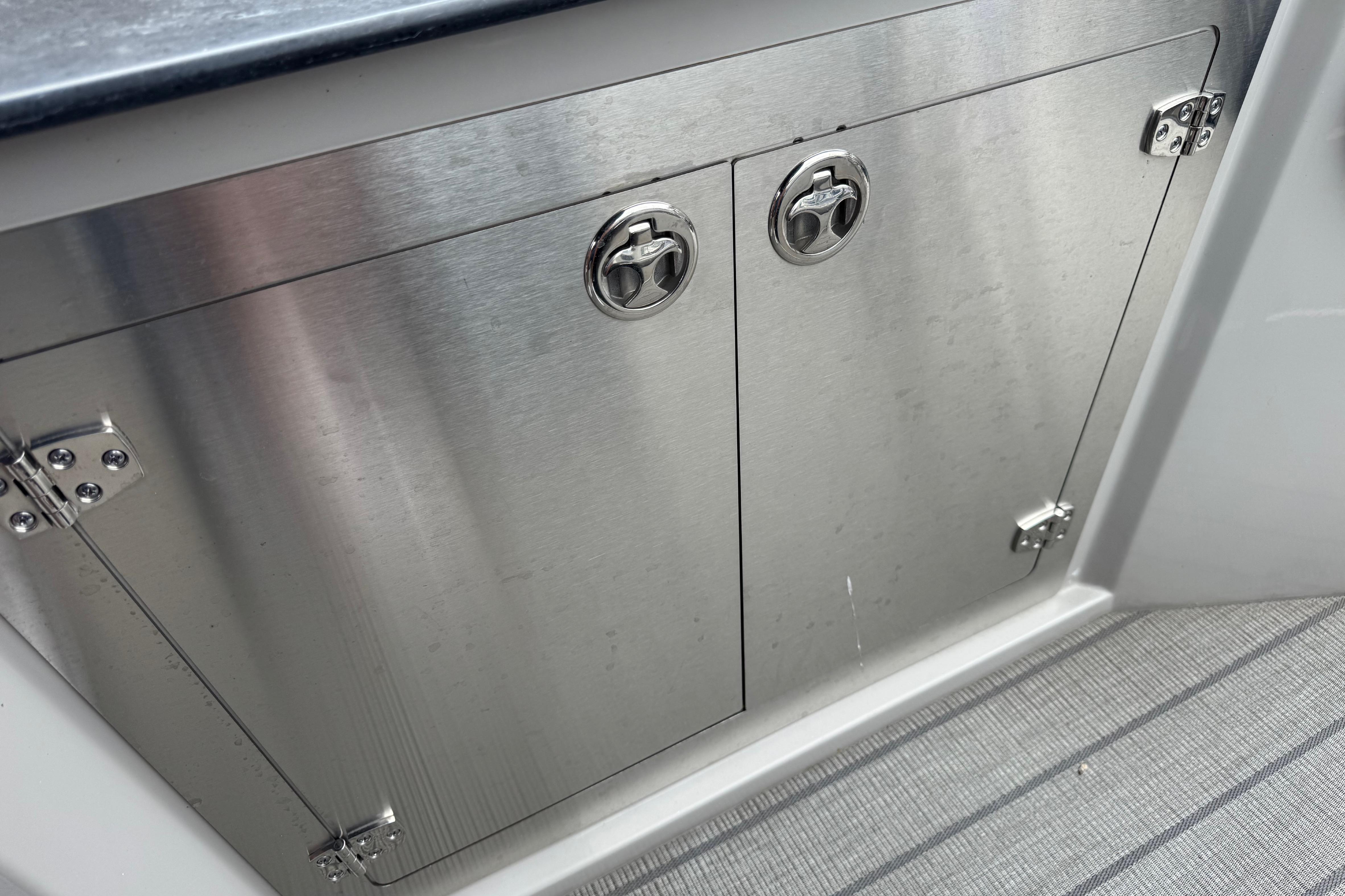 Stainless steel cabinet doors on 2023 Starcraft MX 25 DL DH boat.