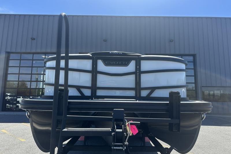 Front view of 2026 Evotti 523QL boat on trailer outside industrial building.