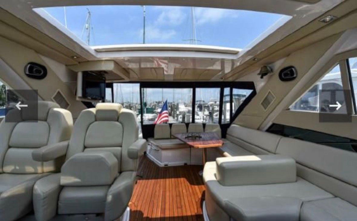 Interior of a 2010 Regal 52 Sport Coupe yacht with luxurious seating.