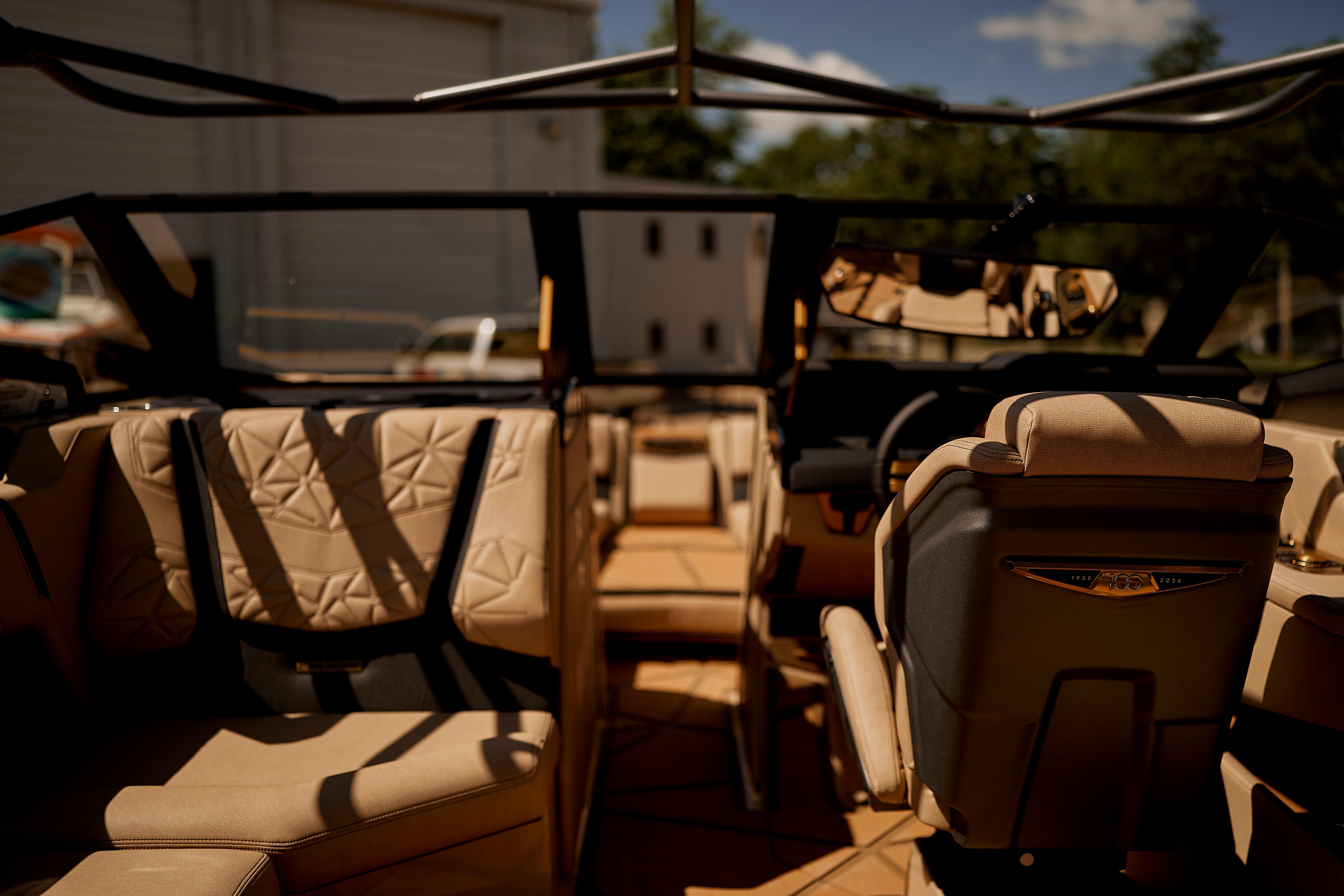 Luxurious interior of 2025 Nautique Super Air Nautique G25 Paragon boat with beige seating.