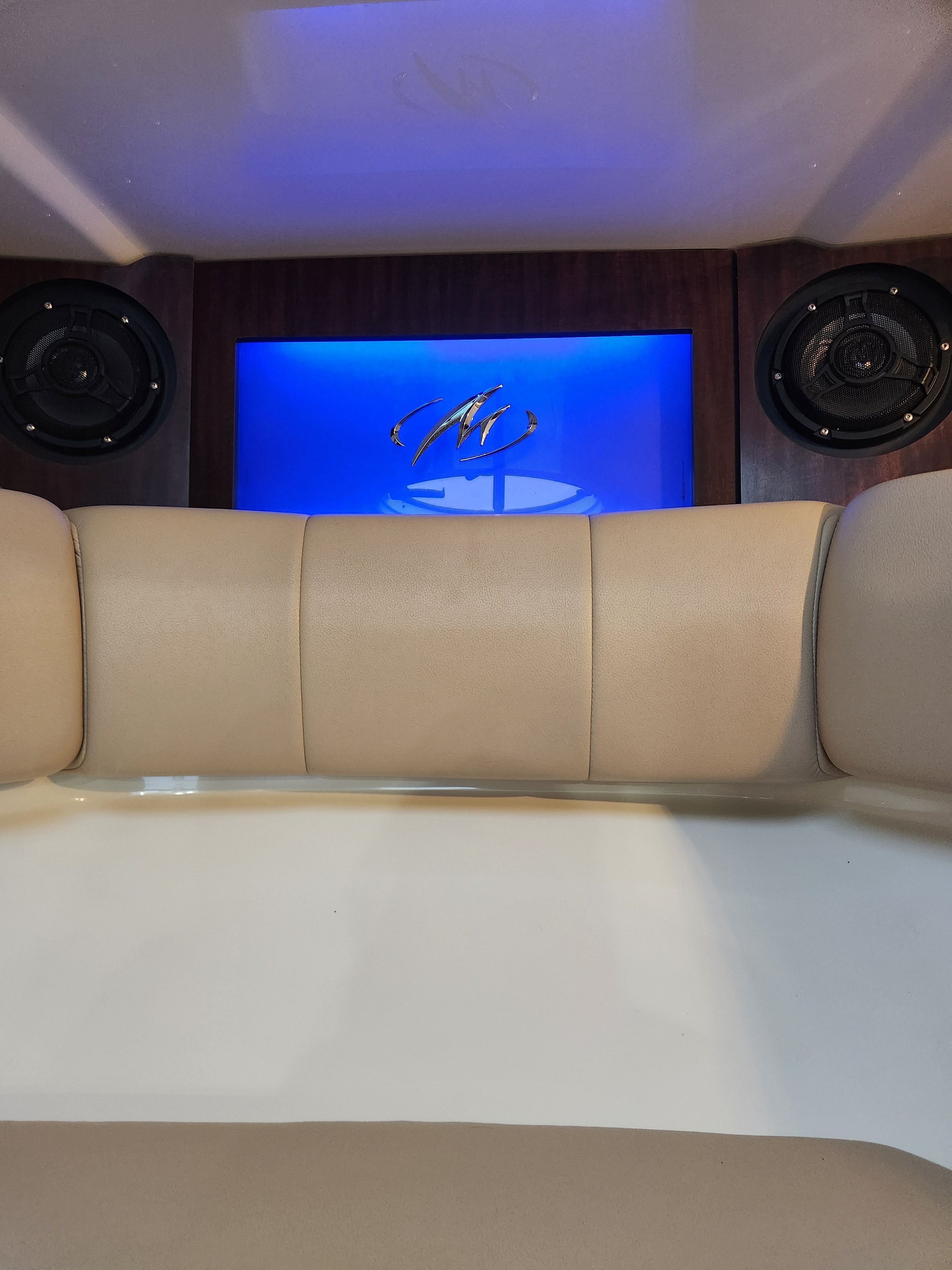 Interior of a 2015 Monterey 268SSC with blue lighting.