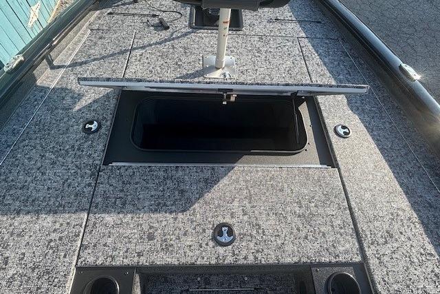 2026 Tracker Pro Team 195 boat deck with open storage compartment.