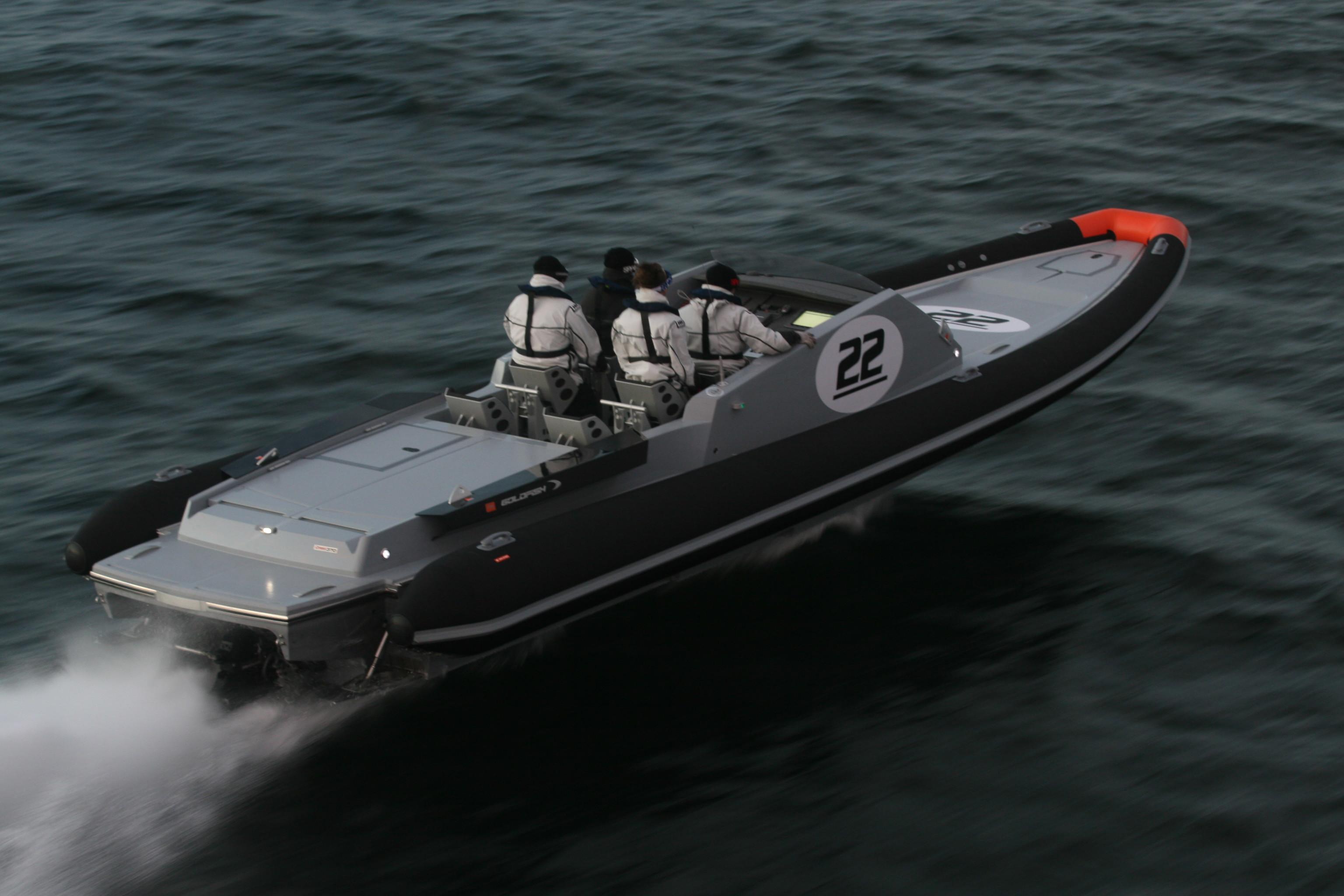 2012 Goldfish 36 P1 SuperSport speedboat on water with passengers, side view.