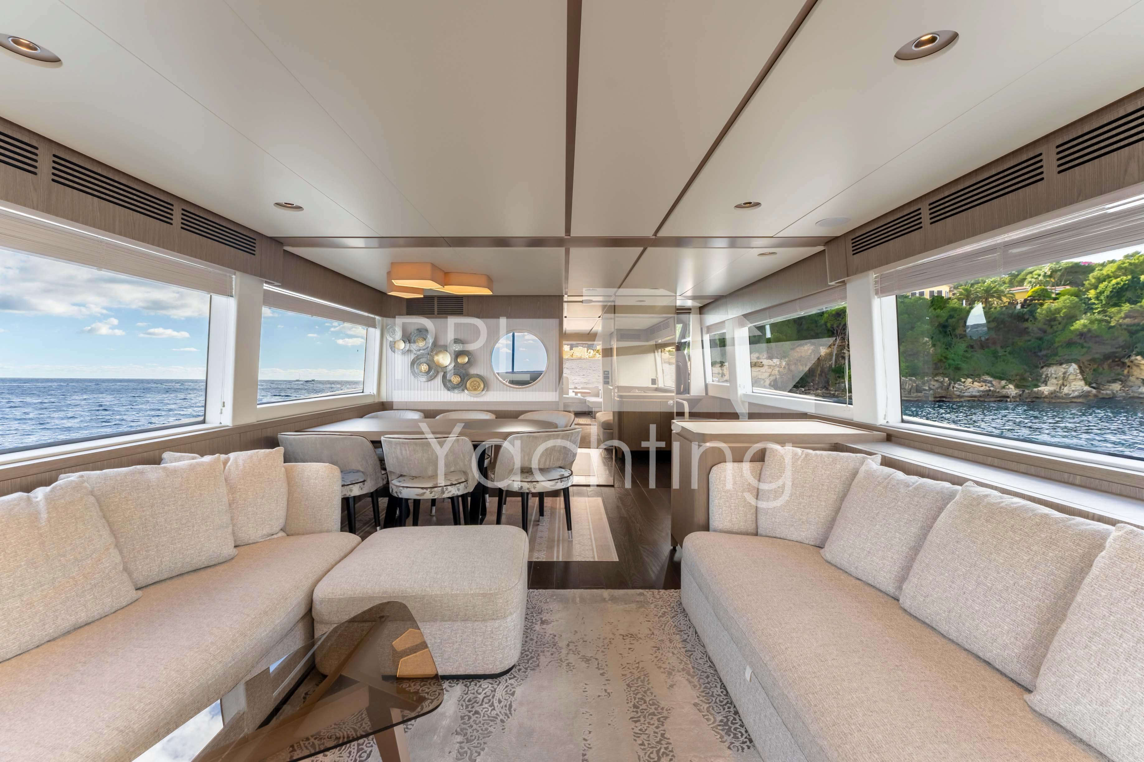 Luxurious interior of 2021 Azimut Magellano 66 yacht with panoramic ocean views.