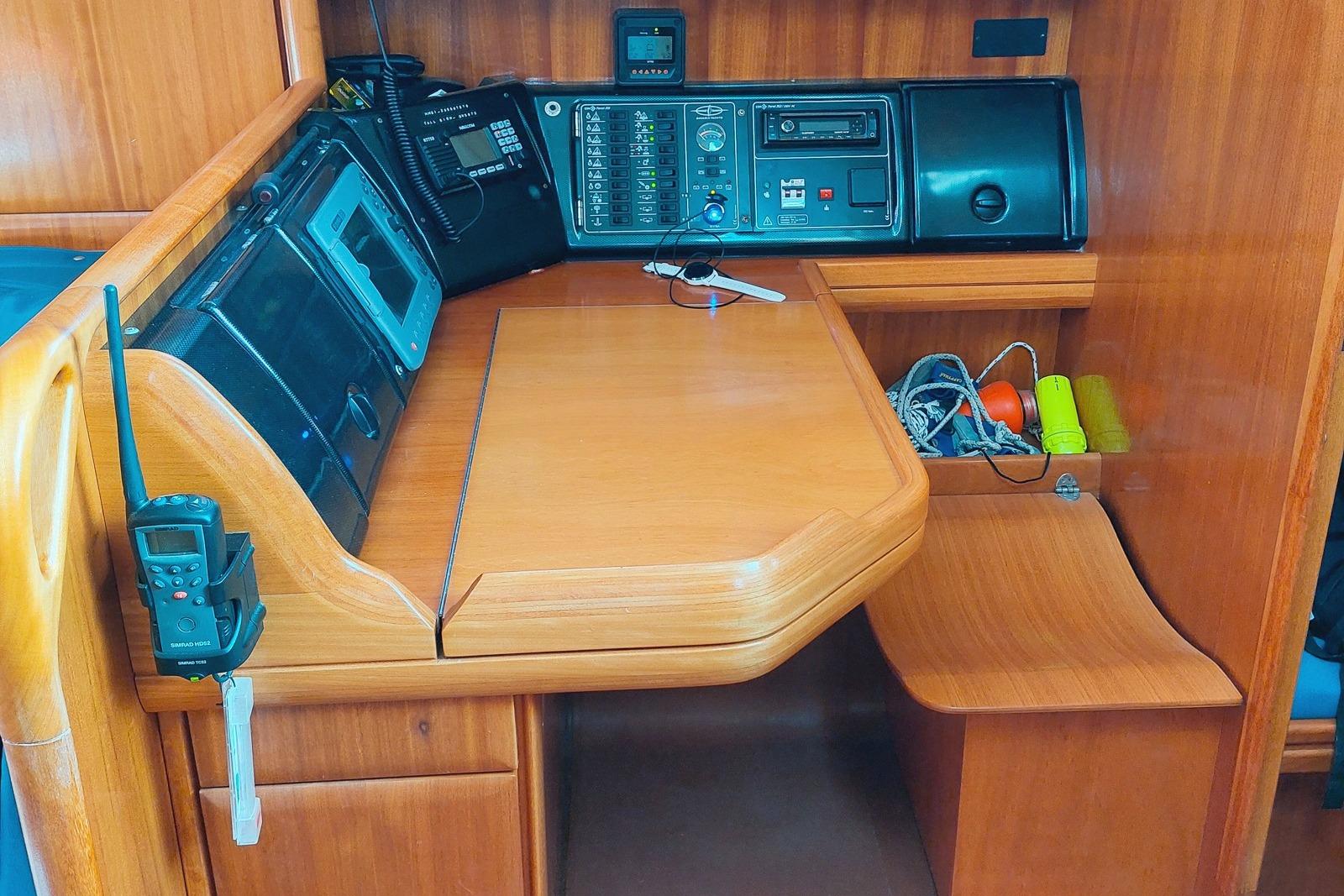Navigation station of a 2005 Bavaria 42 Cruiser yacht with communication equipment.