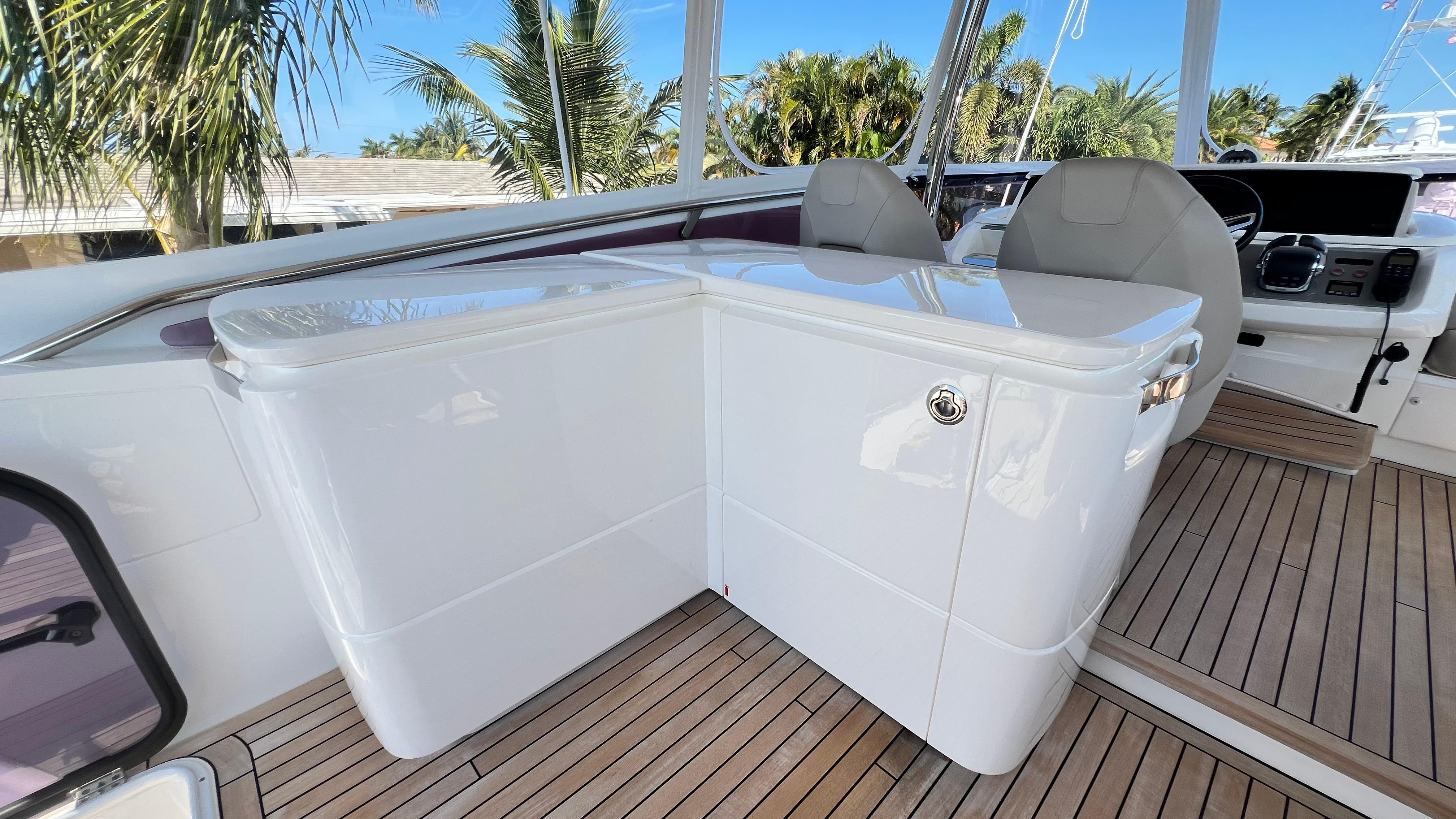 2019 Princess F62 yacht helm with sleek design and wooden deck.