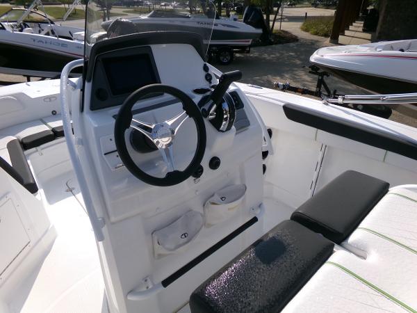 2024 Tahoe 2150 CC boat interior with steering wheel and control panel.