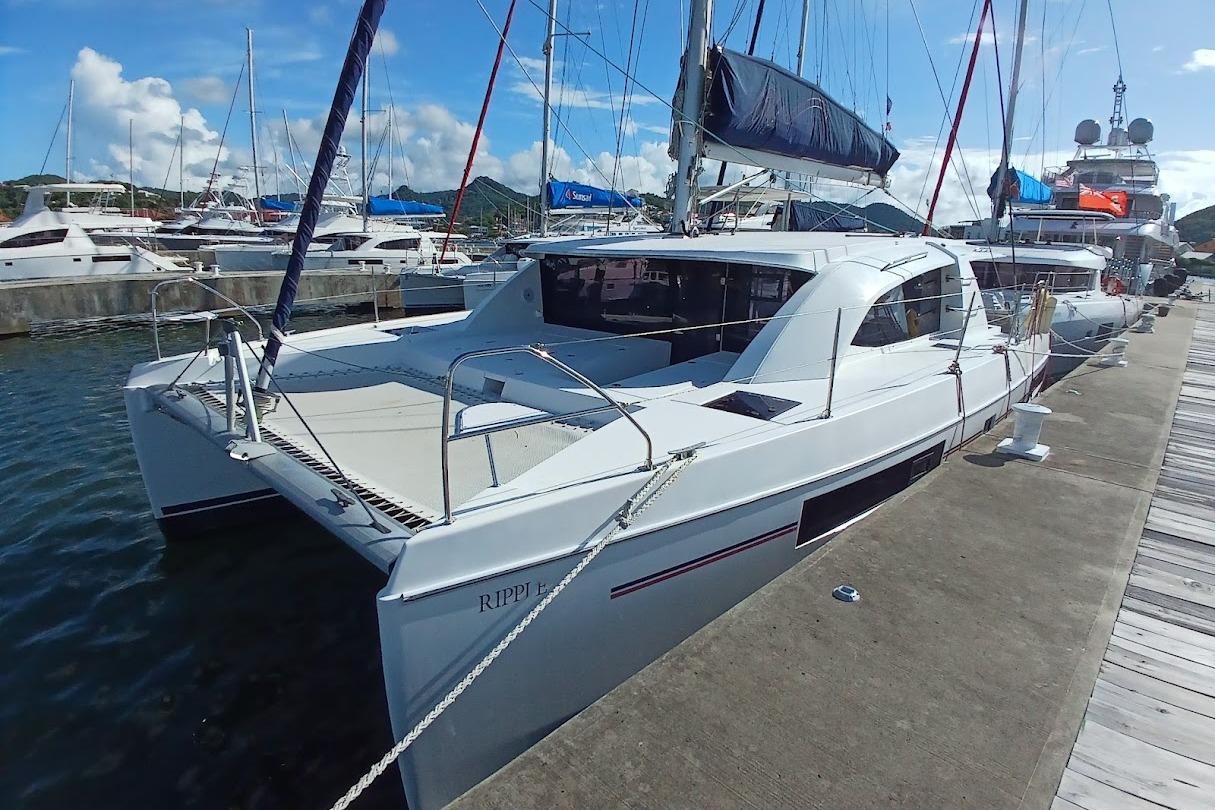 2020 Leopard 40 catamaran docked at a marina under a clear blue sky.