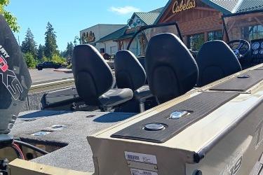 2026 Tracker Targa V-19 Combo boat parked outside Cabela's store.