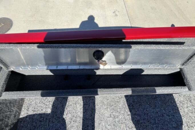 2025 Tracker Super Guide V-16 T boat interior with storage compartment and key.