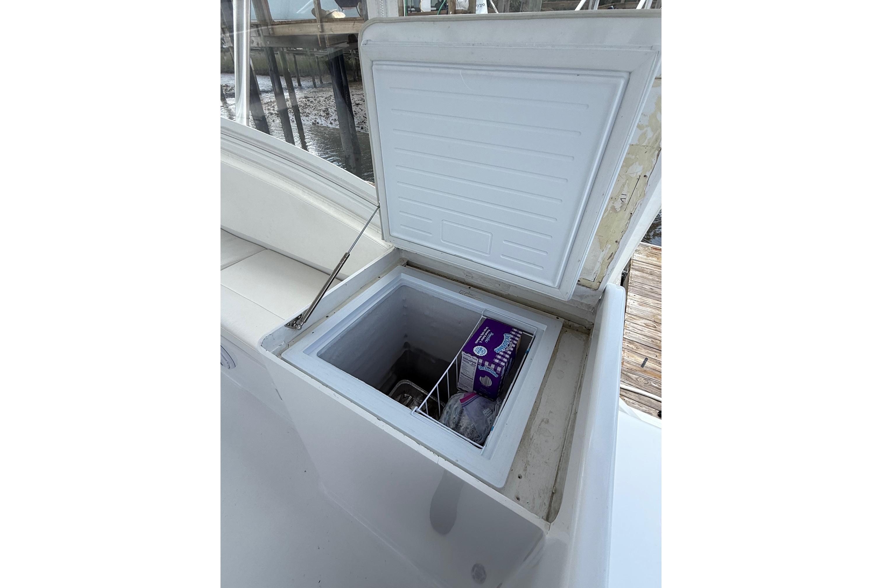 Open storage compartment on 2006 Custom Carolina Heritage Express boat.