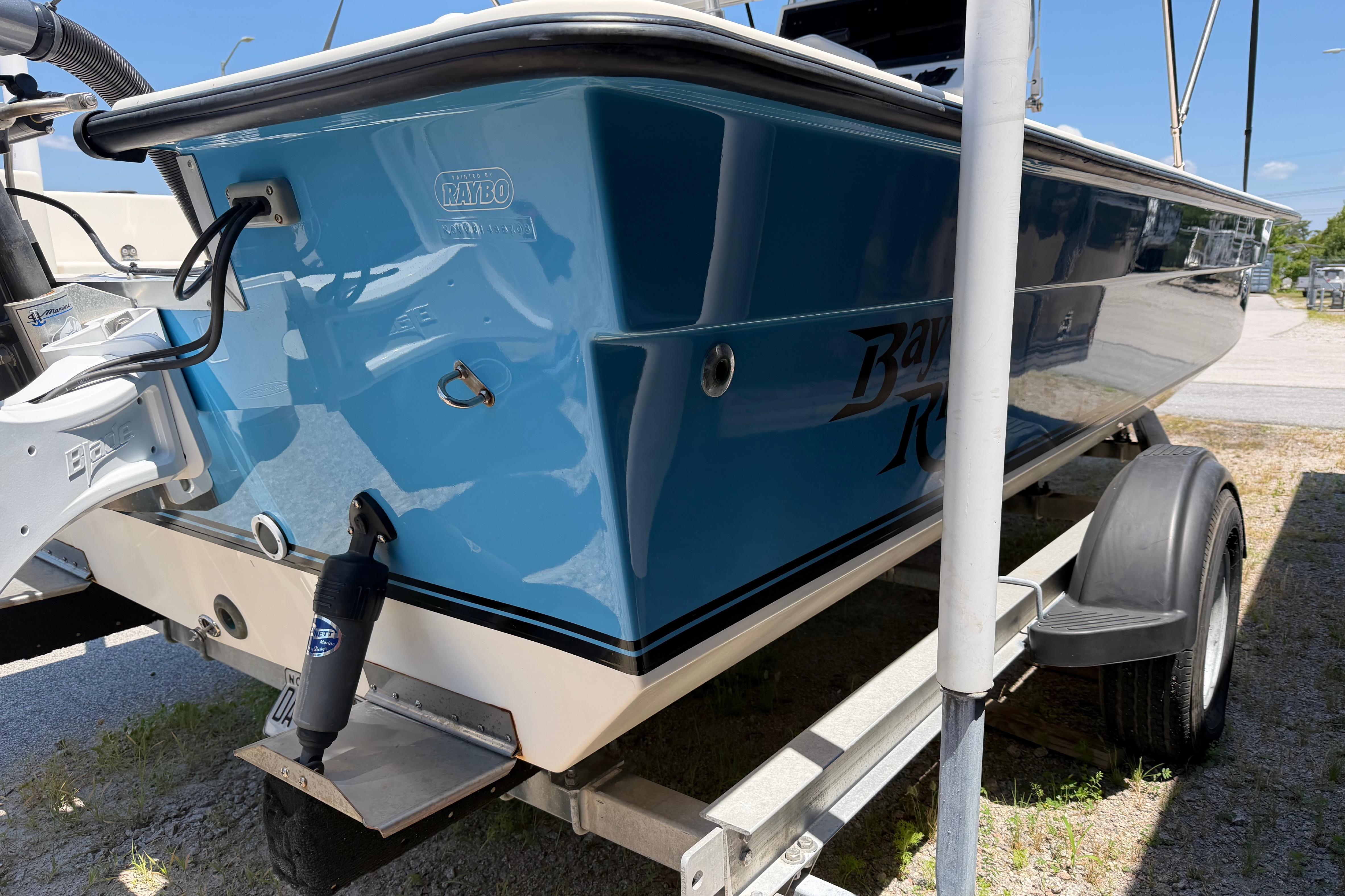 2008 KenCraft Bay Rider 2060 boat on trailer, blue hull, parked outdoors.