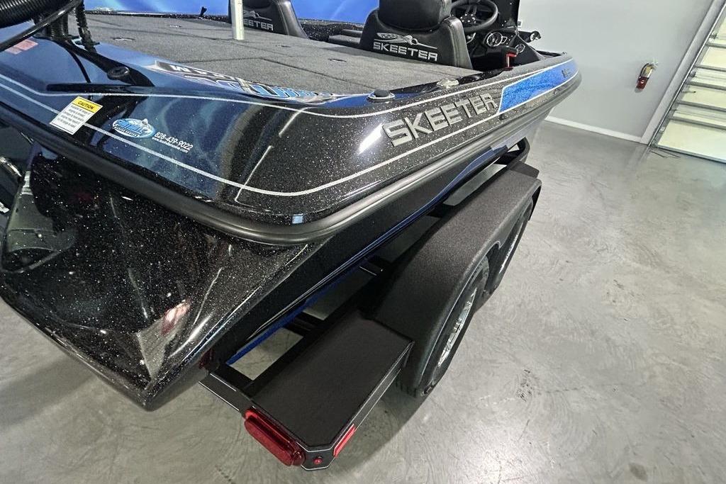 2026 Skeeter ZX200 boat in showroom, showcasing sleek design and branding details.