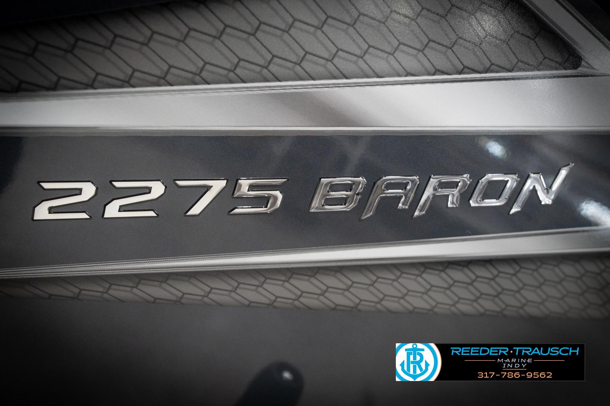 2026 Lund 2275 Baron boat emblem with textured background and Reeder-Trausch Marine logo.