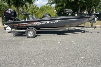 2019 Tracker Pro Team 190 TX boat on trailer, parked outdoors.