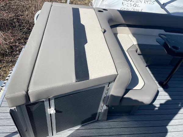 2025 Armada Saphir 23CR boat seating with gray upholstery and storage compartments.