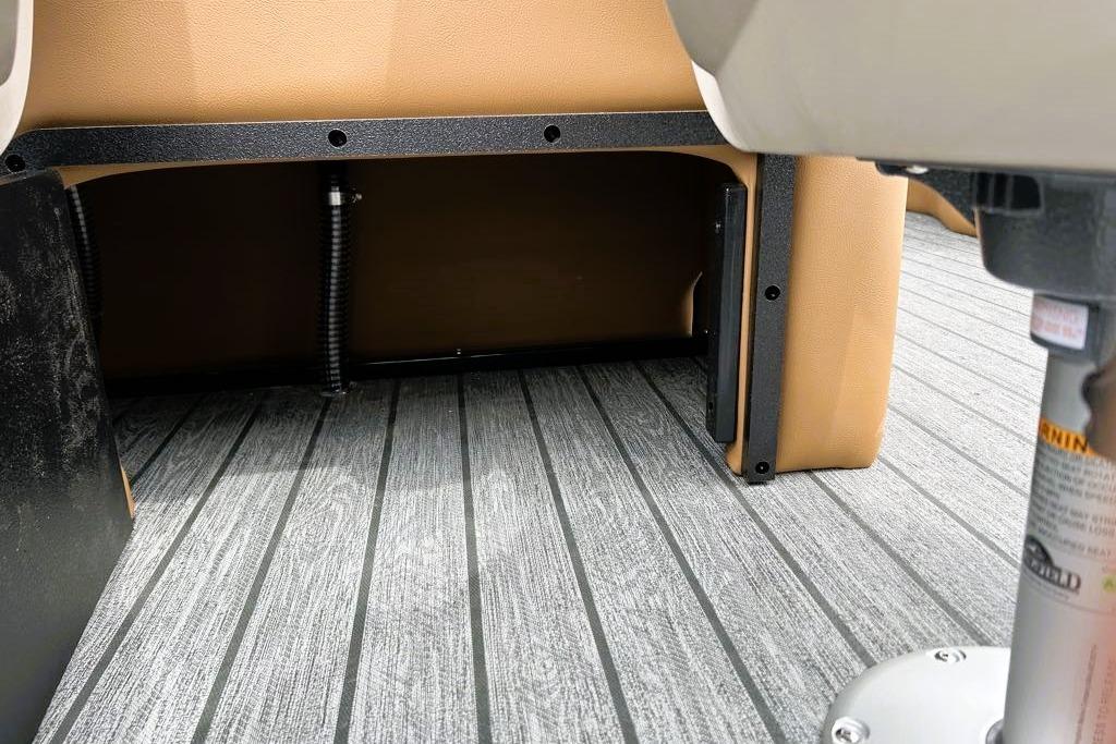 2026 Ranger 220FC boat interior with gray flooring and tan seating.