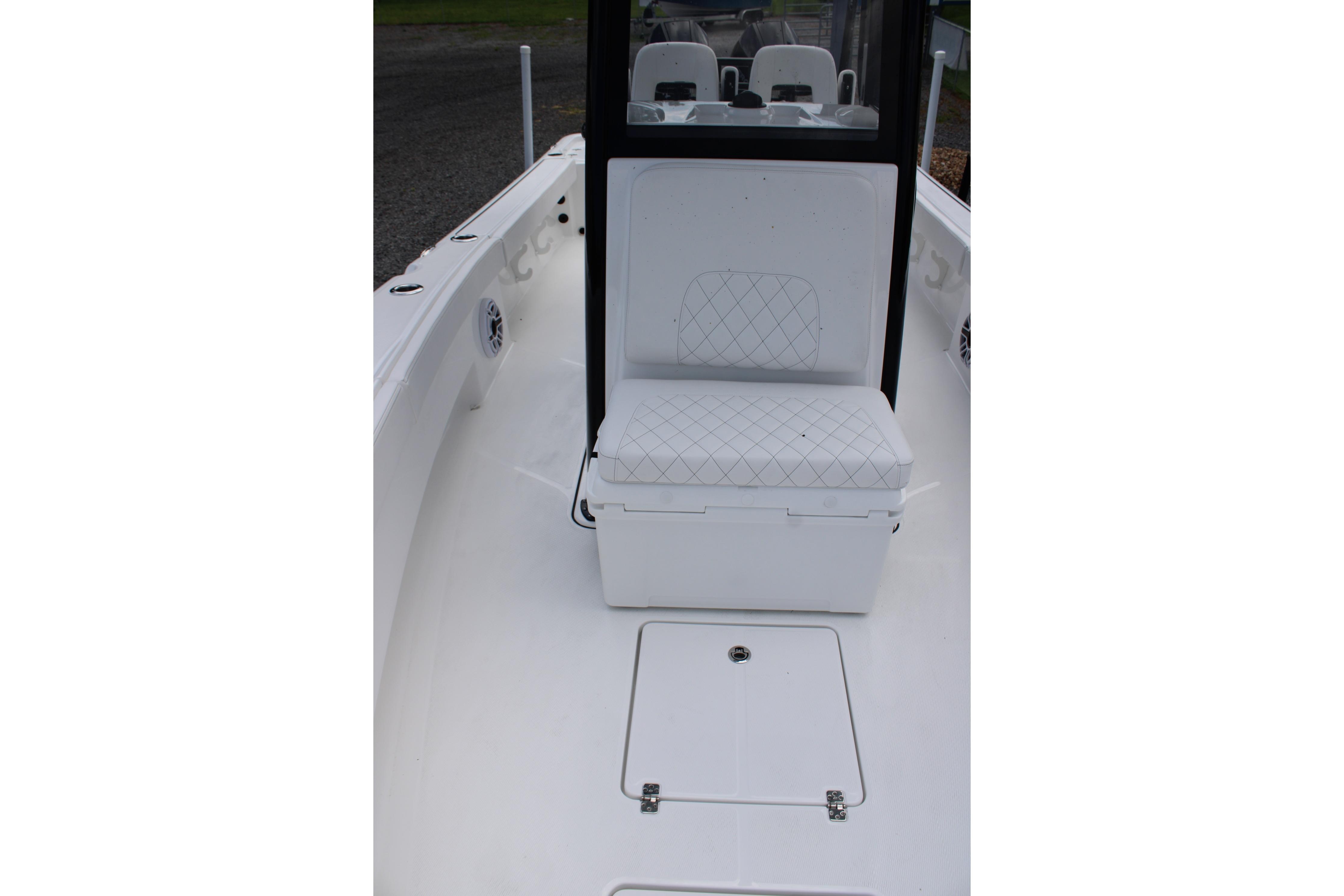 2027 Blazer Bay Makaira 2800 boat interior with cushioned seating and storage compartment.