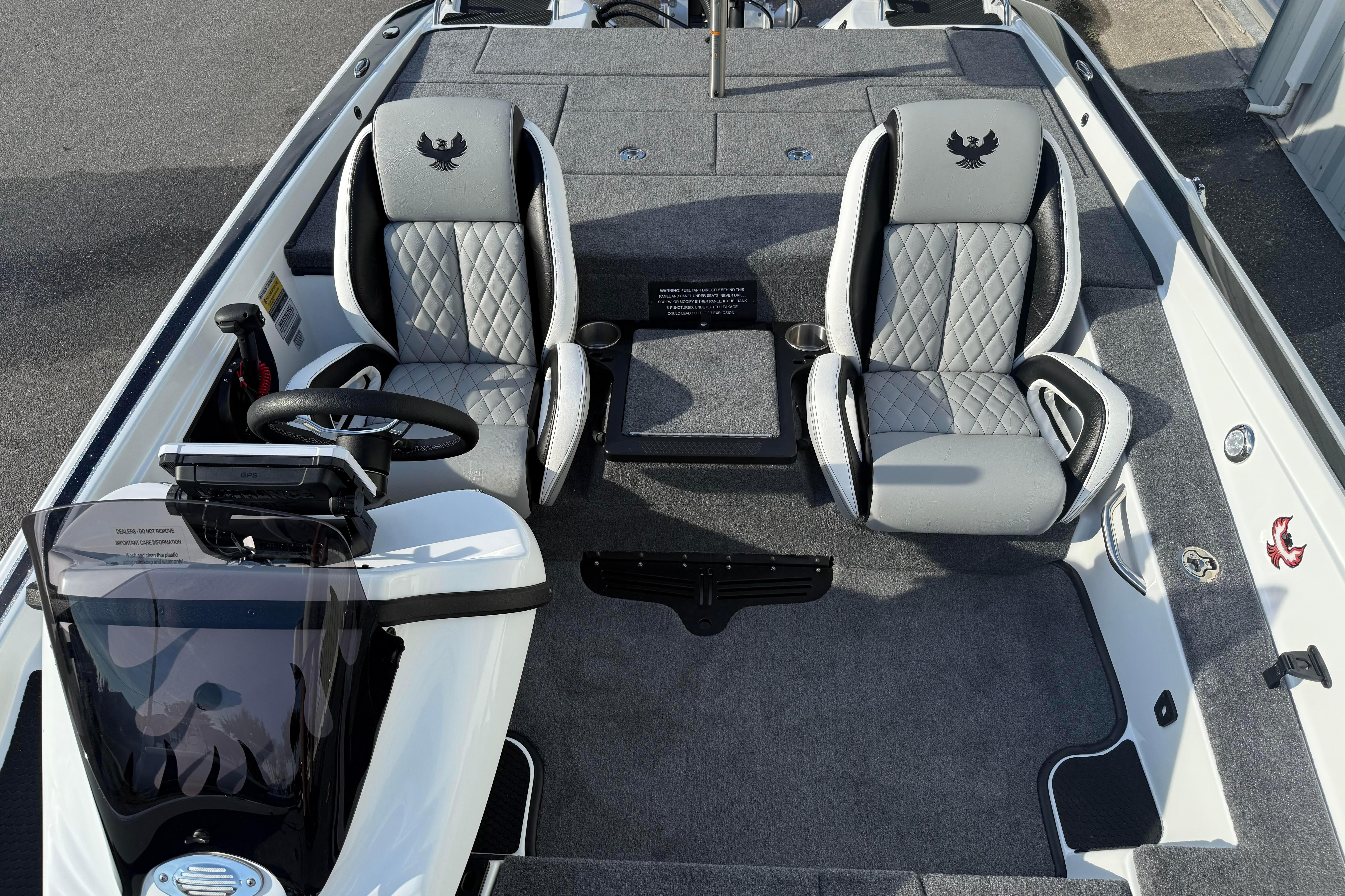 2027 Phoenix 721 ZXL boat interior with dual seats and steering console.