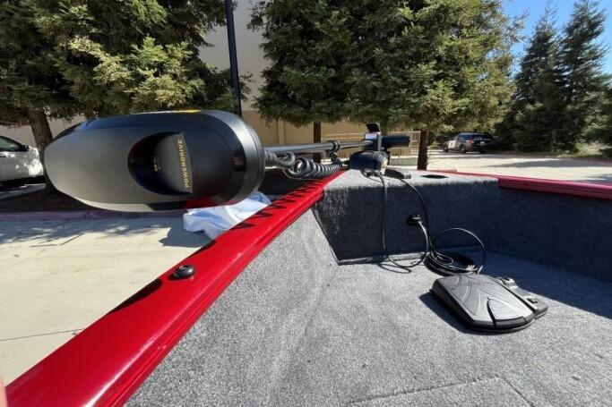 2025 Tracker Super Guide V-16 T boat interior with trolling motor and foot pedal.