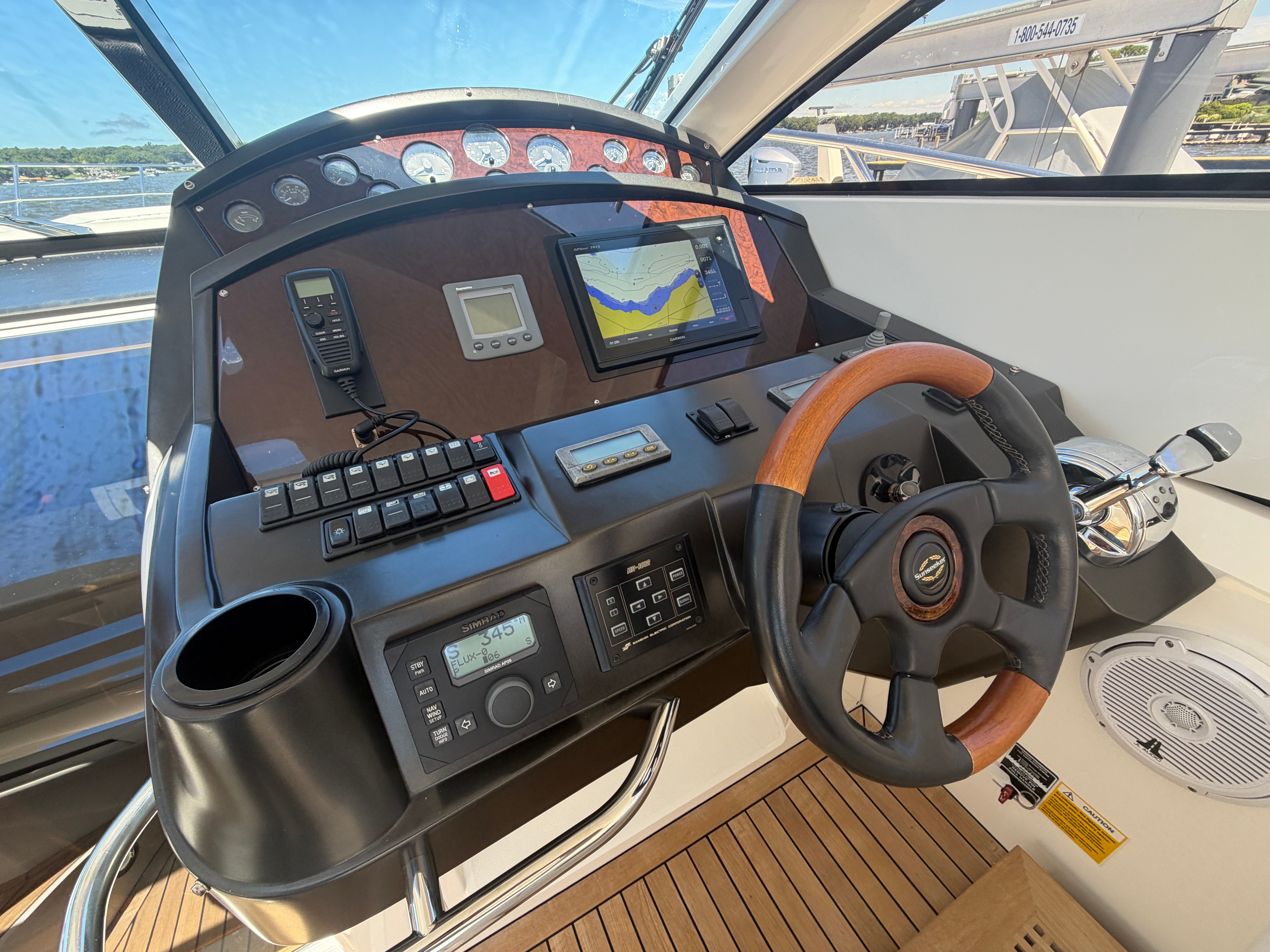 The image shows the helm of a 2008 Sunseeker Portofino 53.