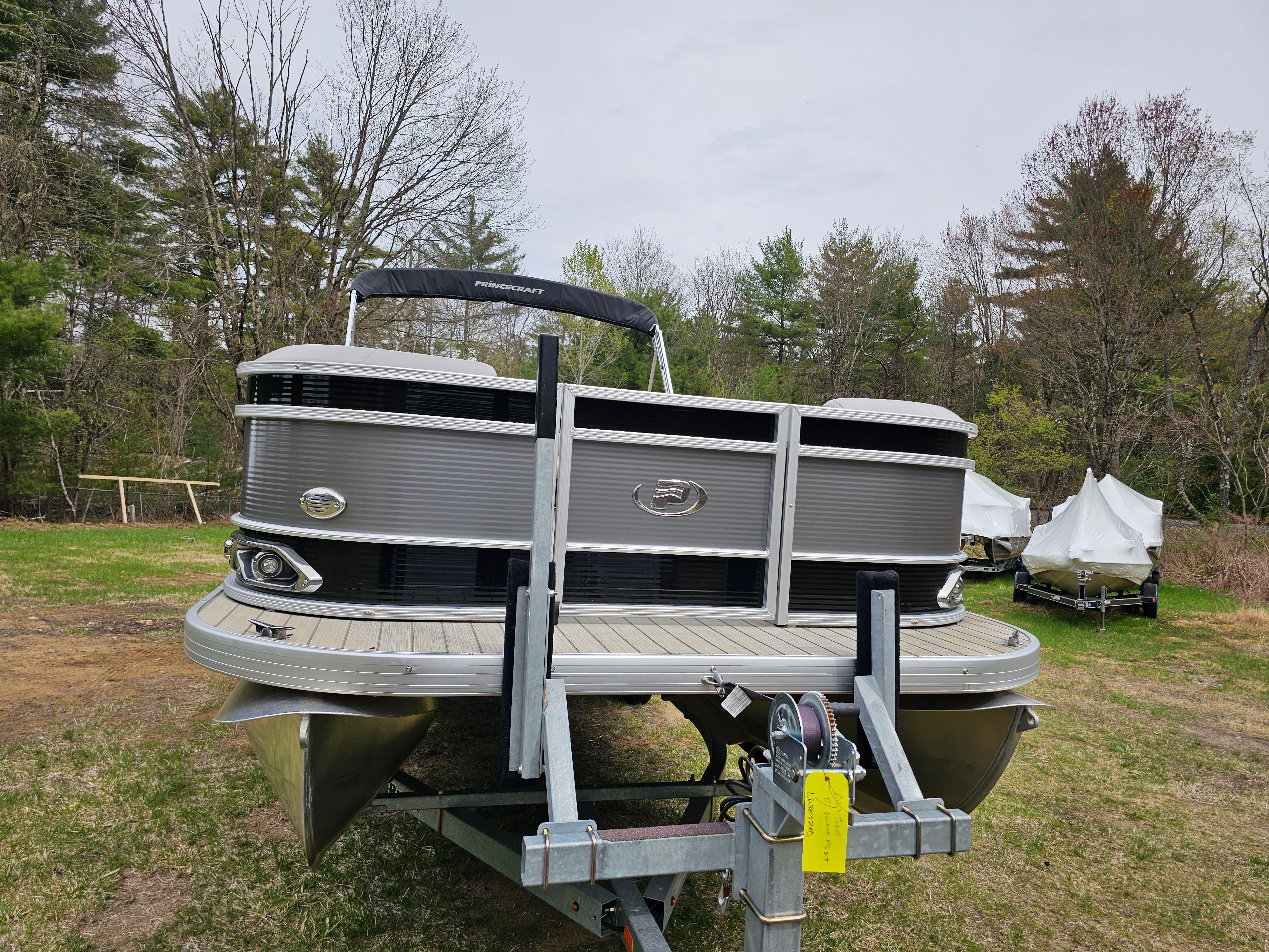 2021 Princecraft Vectra 23XT pontoon boat on trailer outdoors.
