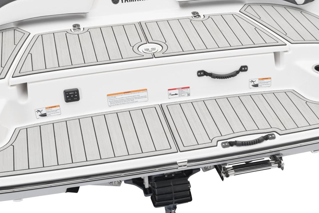Manufacturer Provided Image: 2026 Yamaha Boats SX190 swim platform with teak-style decking and safety handles.