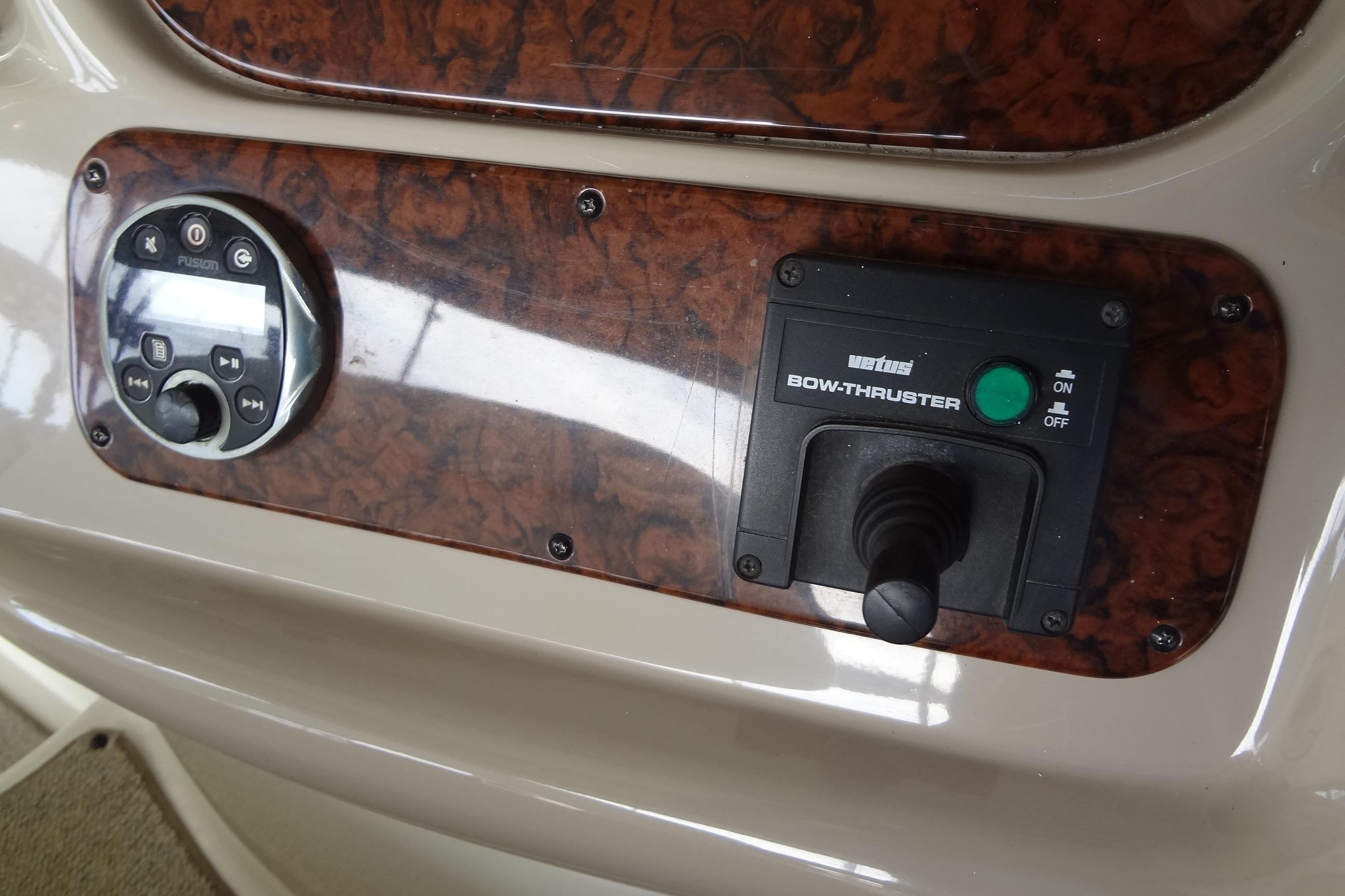 Control panel of a 2001 Sea Ray 380 Sundancer with bow thruster and audio system.