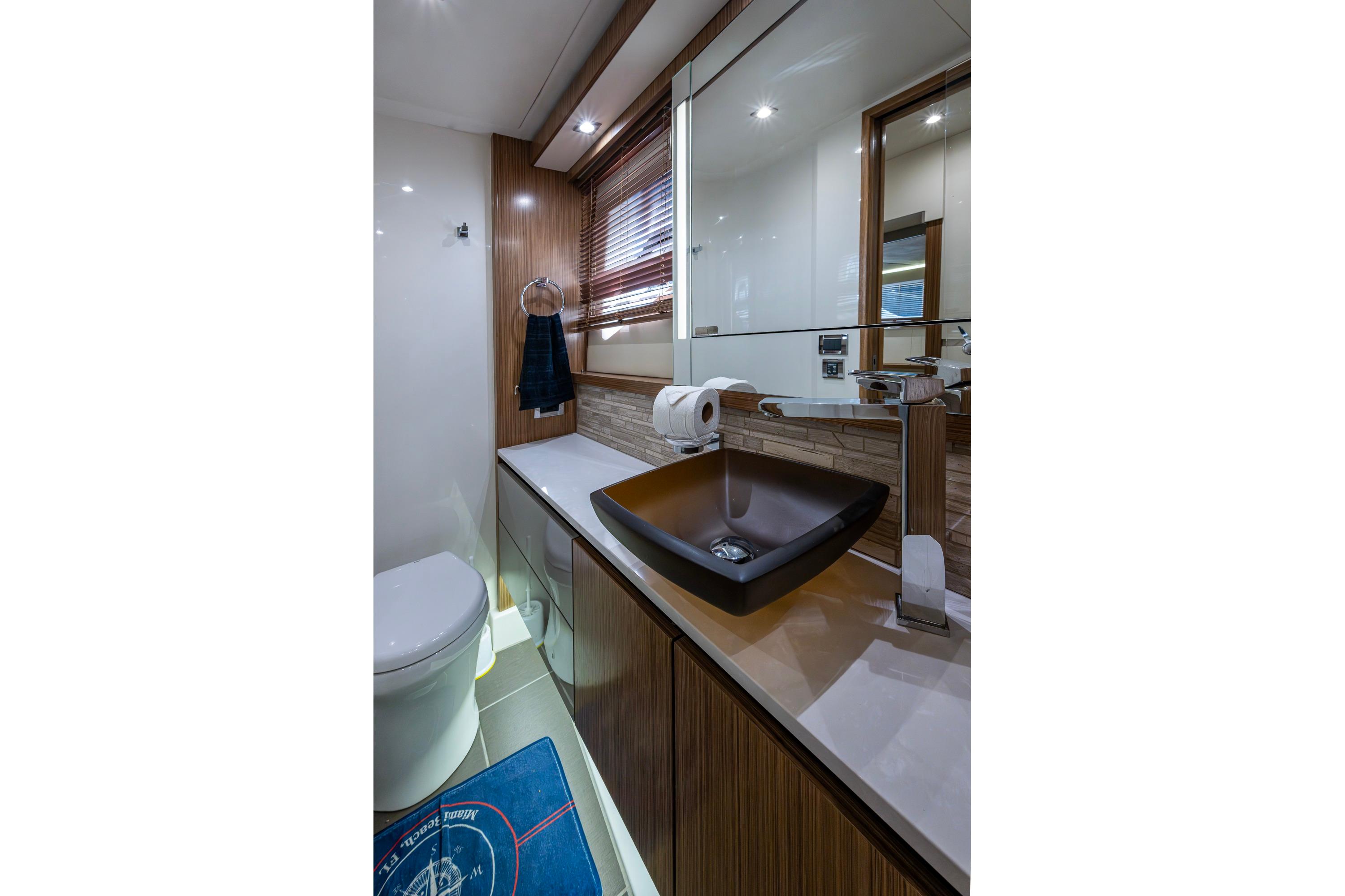 Luxurious bathroom in 2018 Sea Ray L550 Fly yacht with modern fixtures.