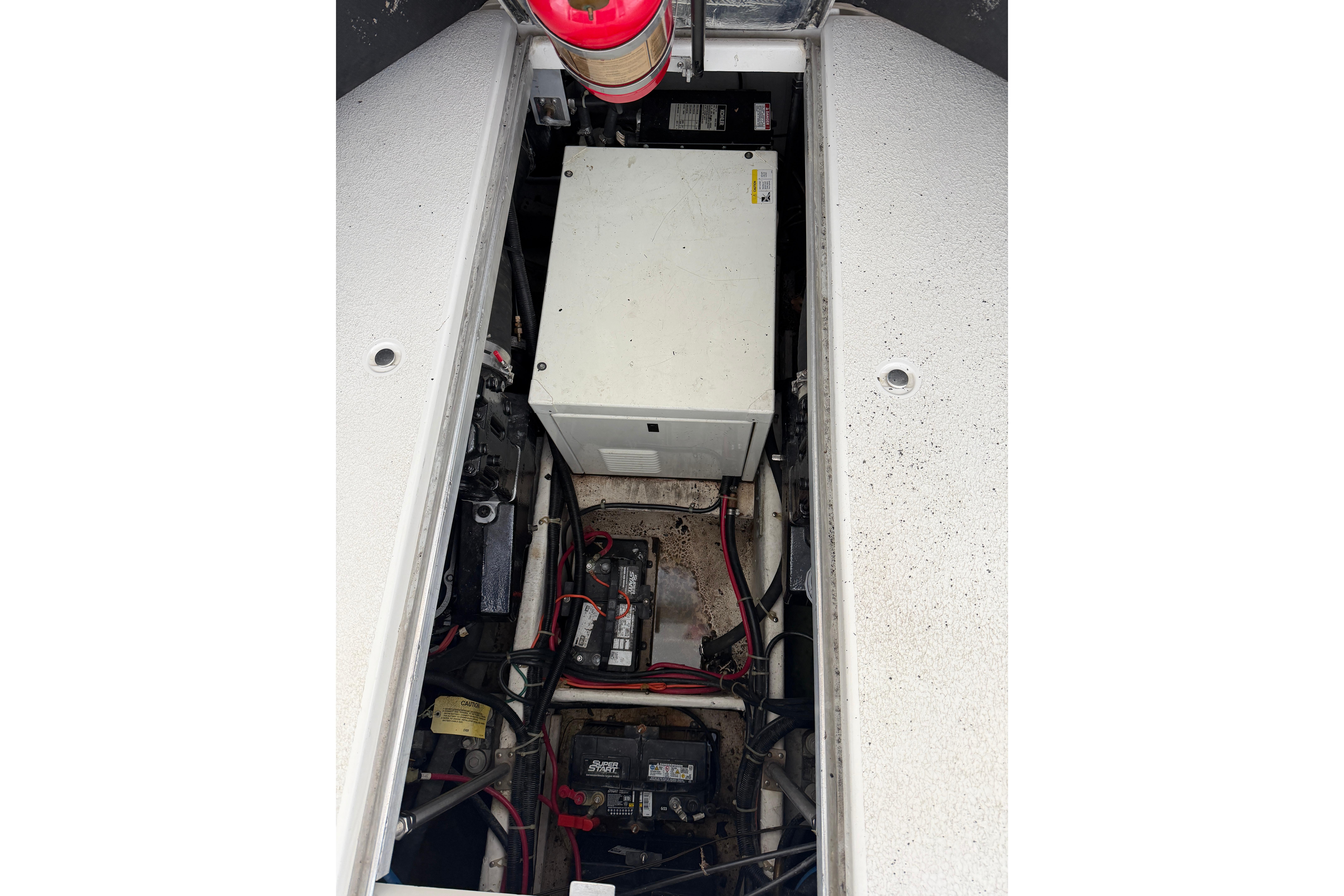 Engine compartment of a 2000 Carver 350 Mariner boat, showing wiring and components.