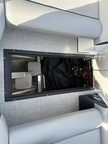 2025 Montara Surf Boss 2.0 25 interior storage compartment with visible wiring and equipment.