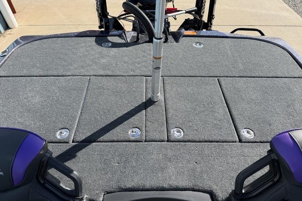2026 Skeeter ZXE21 boat deck with gray carpet and storage compartments.