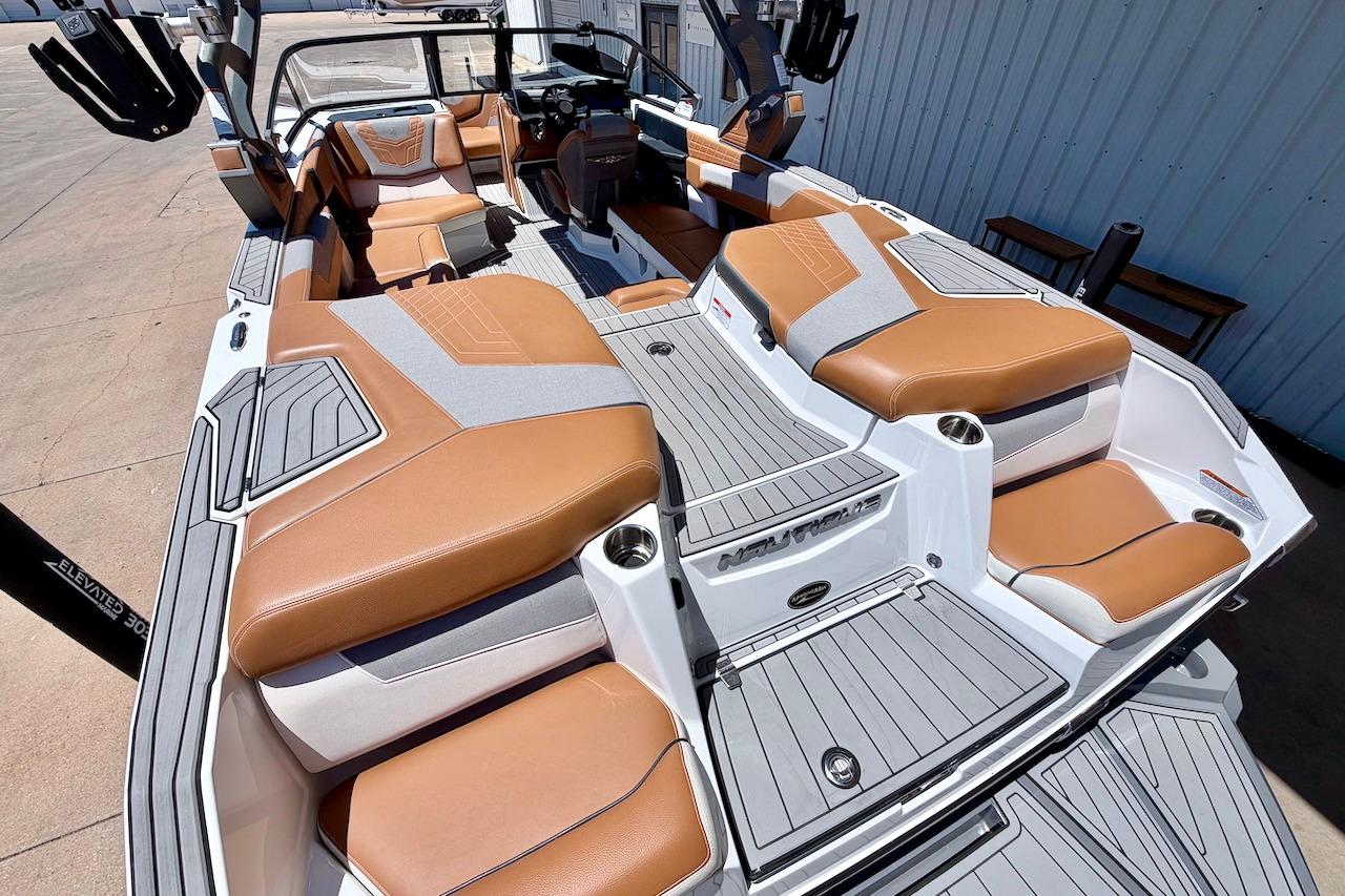 2021 Nautique Super Air Nautique G23 interior with tan and gray seating, showcasing luxury design.