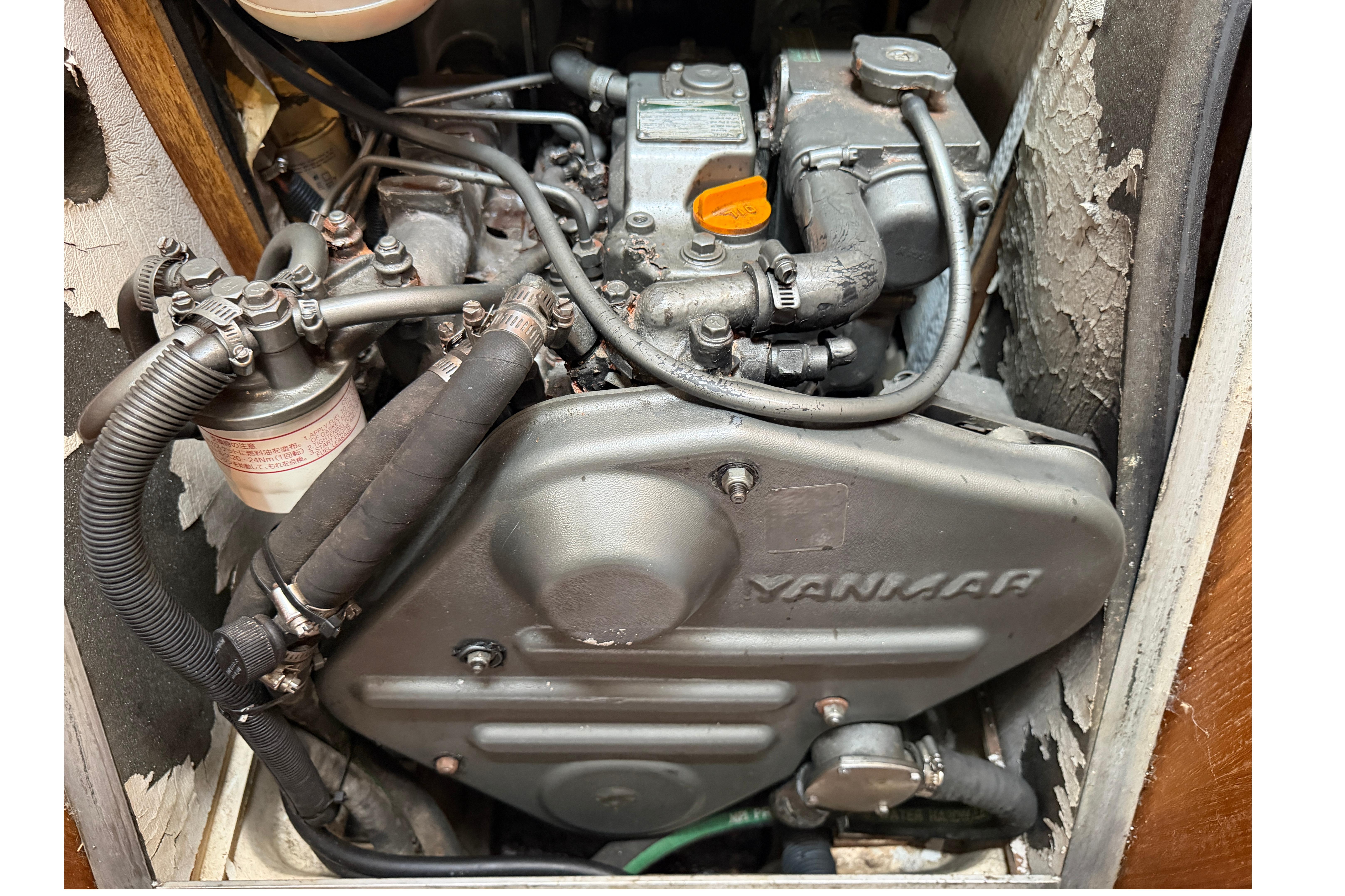 Engine compartment of a 2005 Hunter 38 sailboat featuring a Yanmar engine.