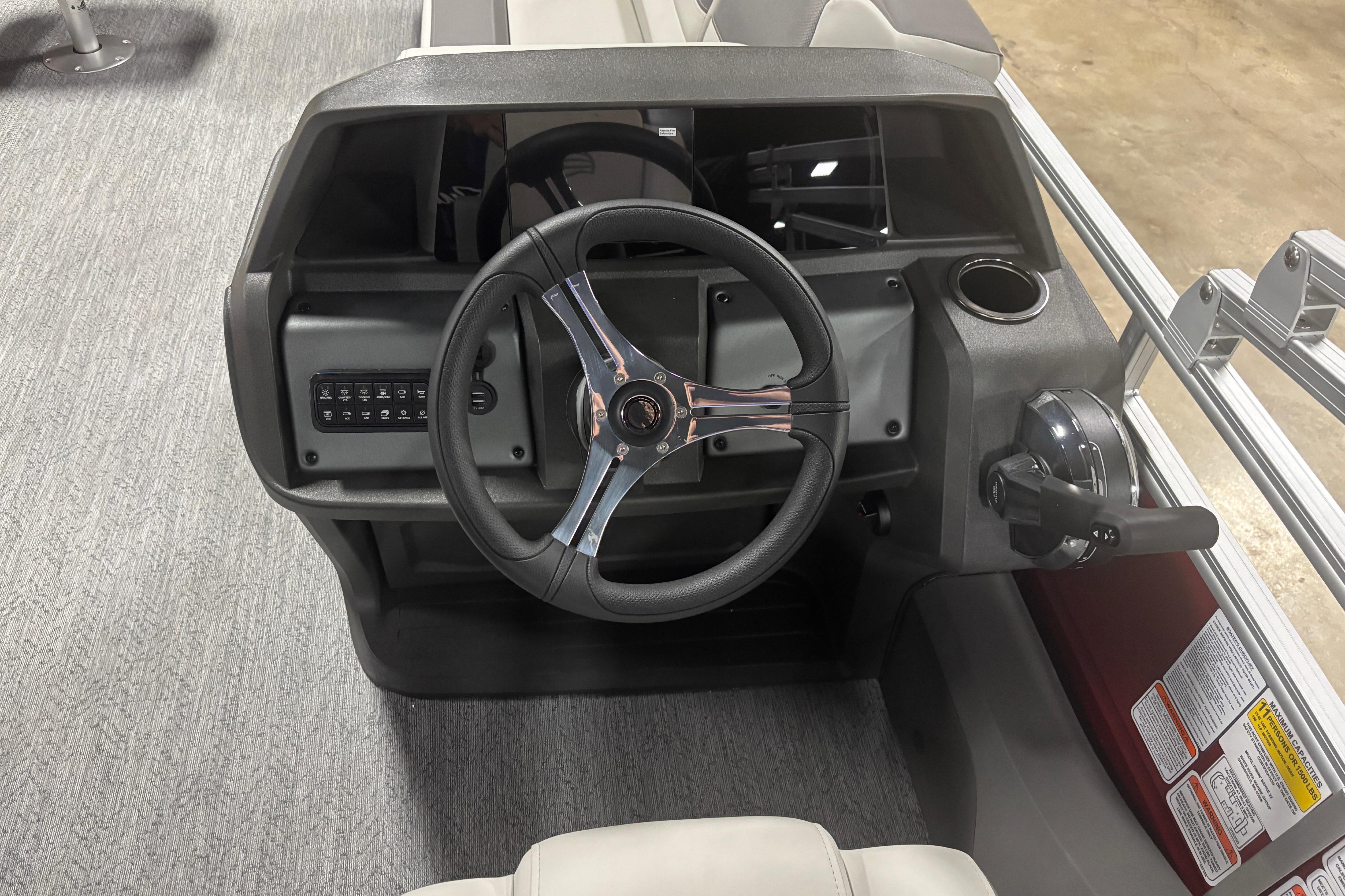 Steering console of 2026 Sun Tracker Fishin' Barge 22 DLX pontoon boat.