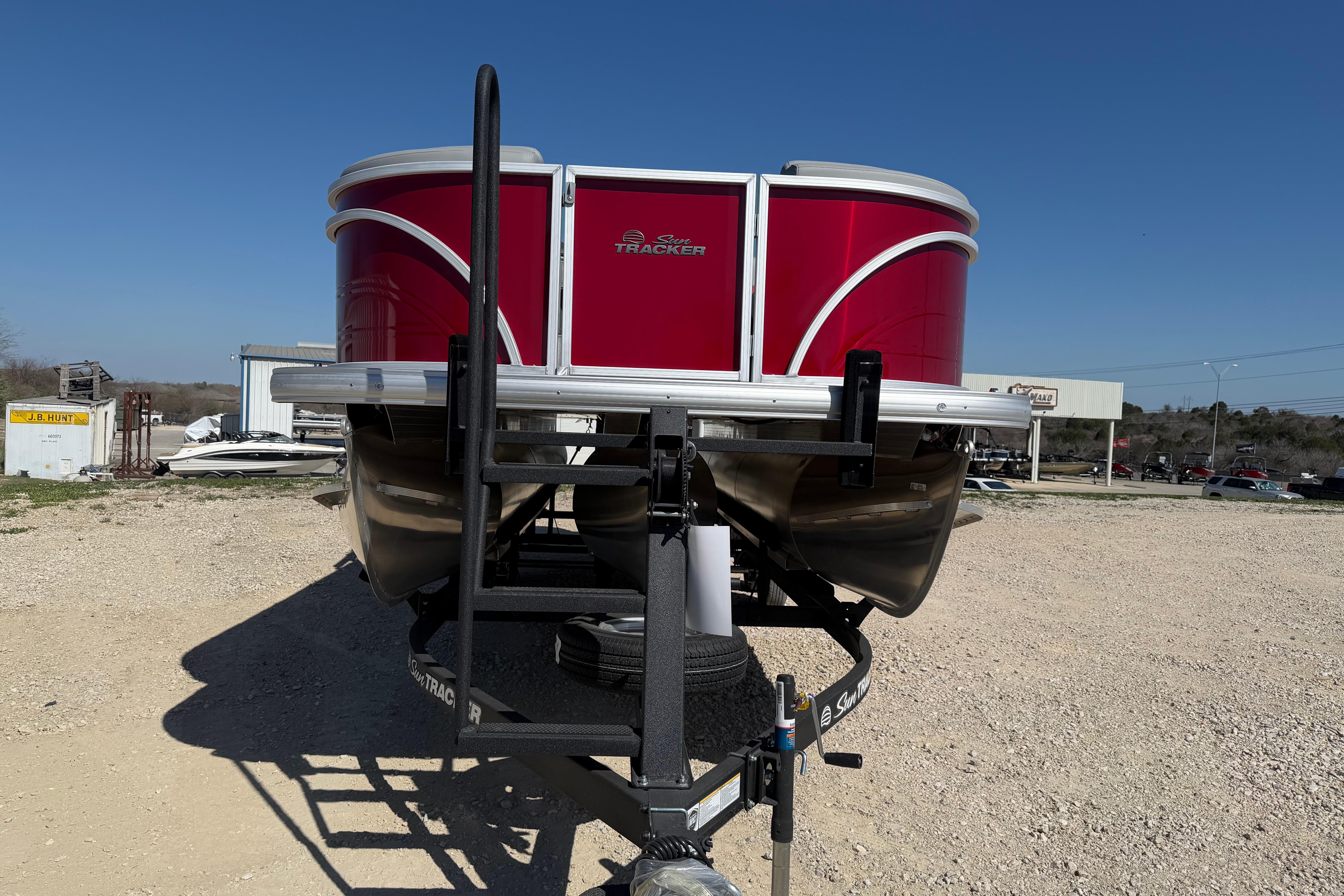 2026 Sun Tracker Party Barge 22 RF XP3 pontoon boat on trailer, red exterior.