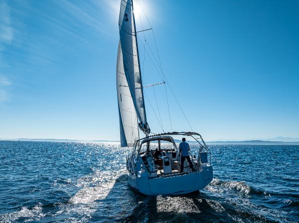 2021 Beneteau Oceanis 38.1 sailboat on open sea.